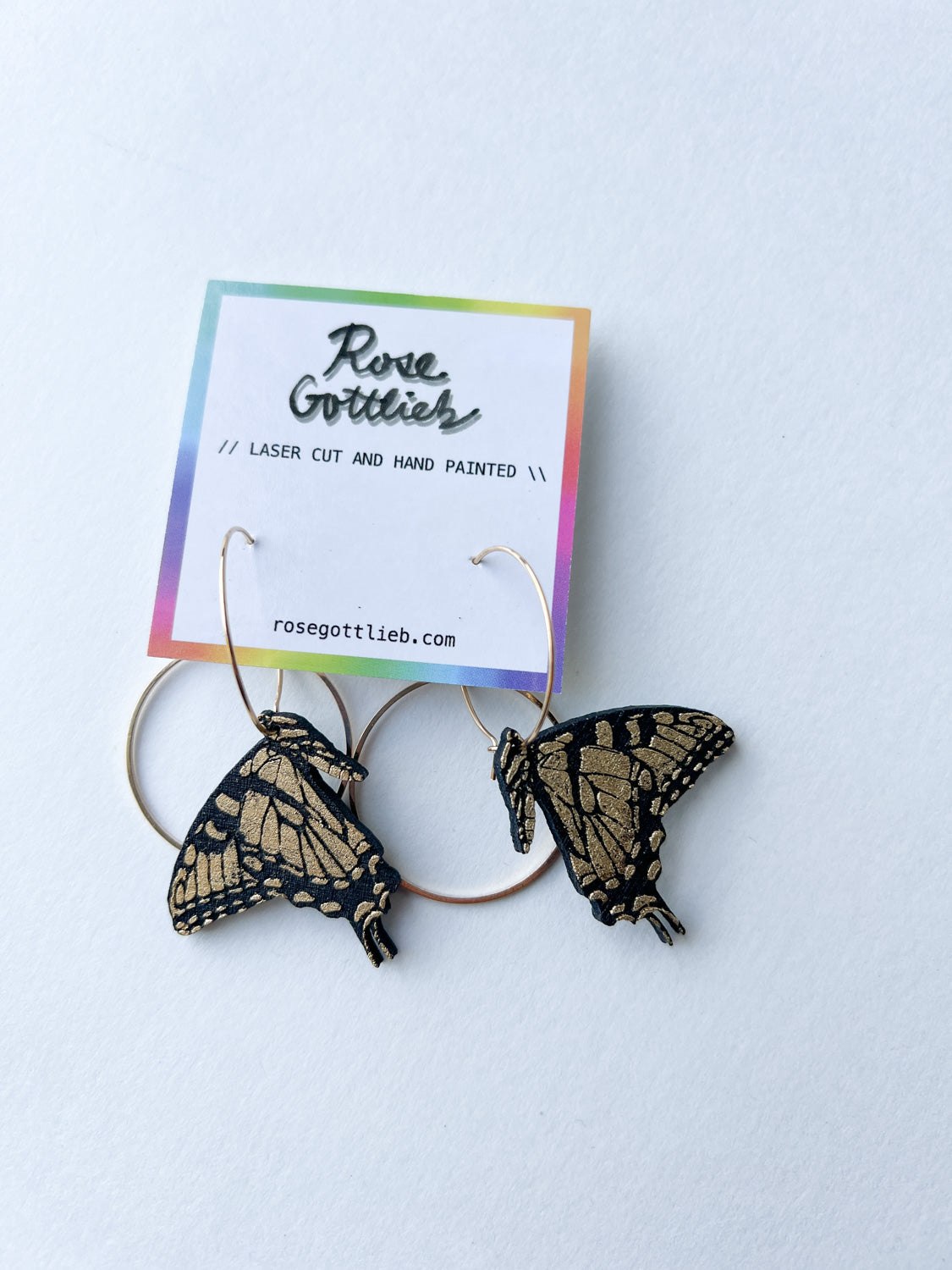 Rose Gottlieb Earrings - small black and gold swallowtails with circles